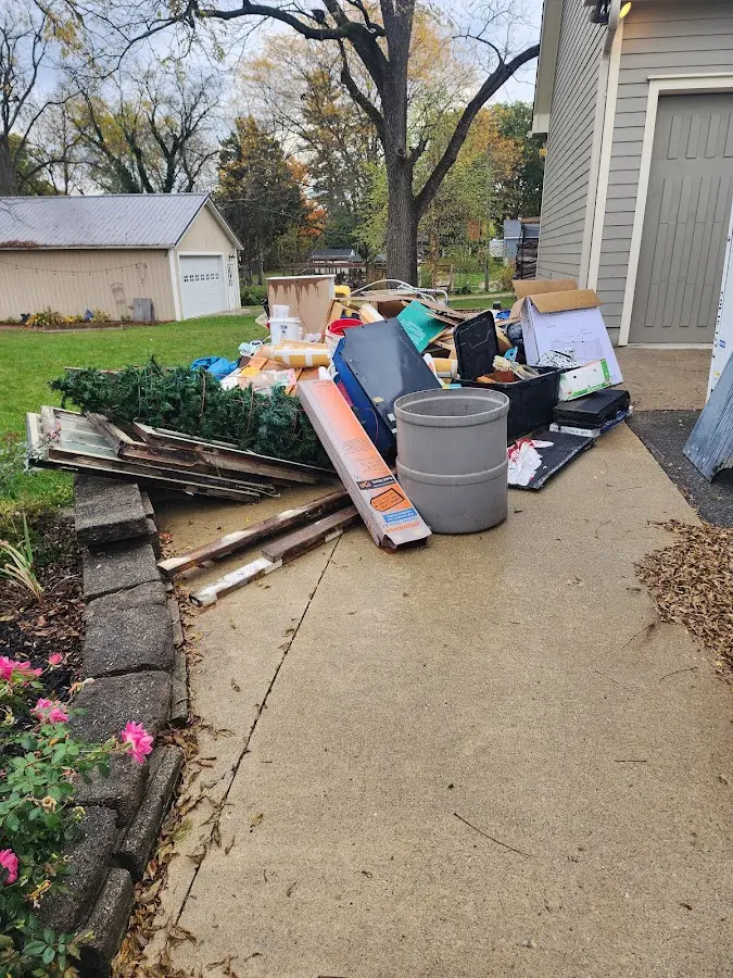 Dumpster being loaded with debris for Roofing Dumpster Rental in Seymour